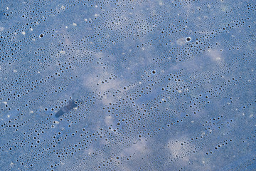 Background of the condensate drops on the film is polyethylene. Water drops texture.