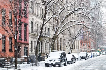 Fotobehang New York Winter scene with snow covered cars parked along Stuyvesant Street in the East Village New York City  © deberarr
