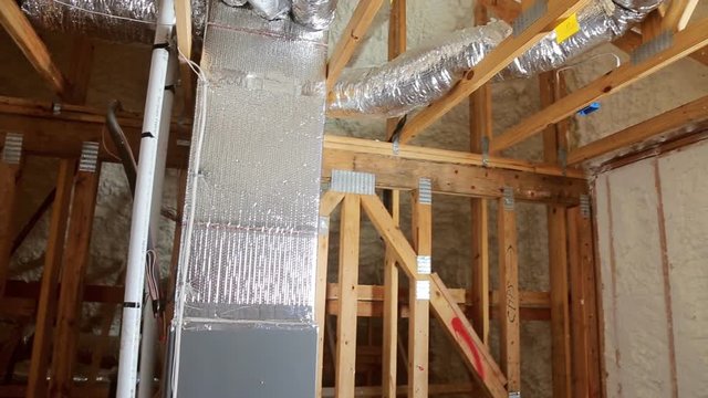 Closeup on termal insulation installing at the attic insulation of the house