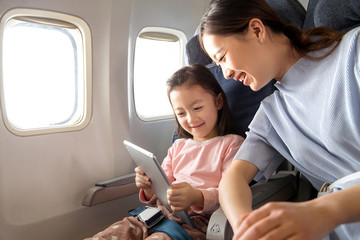 Happy family travel by plane