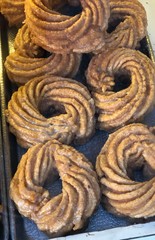 Traditional doughnuts dipped in sugar glaze