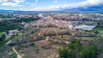 Aerial view of medieval Tortosa in Spain with cathedral, castle and the Ebro river