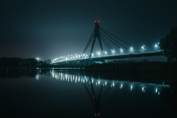 Moscow North bridge, night panorama on illuminated construktion with beautiful reflections in Dnipro river