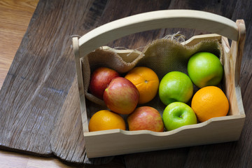 Orange, red apples, green apples in crates, fresh fruits