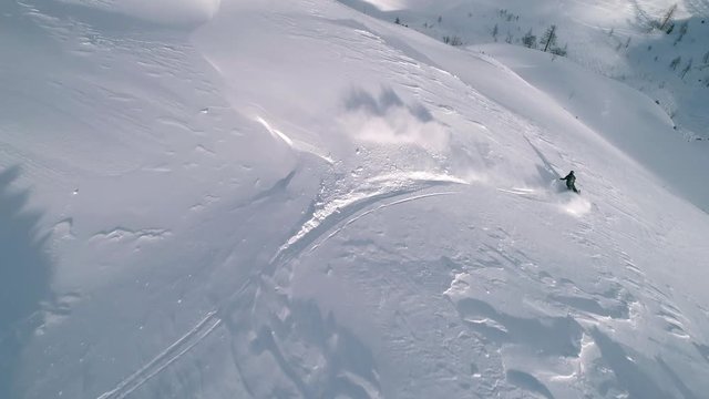 Aerial - Freeride skier going downhill