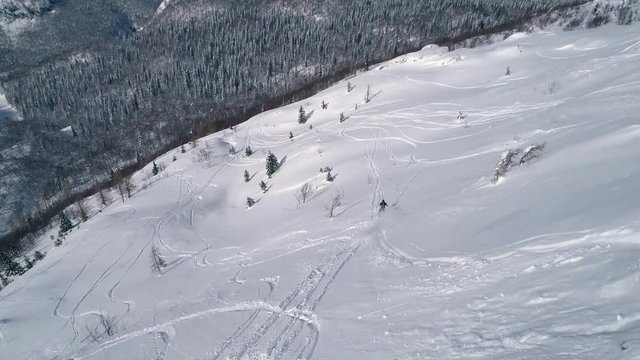 Aerial - Freeride skier going downhill