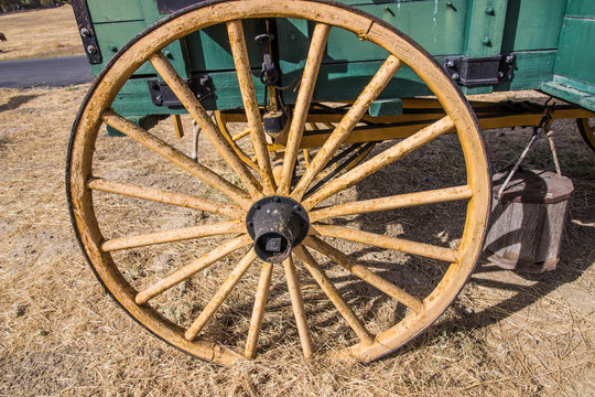 Old Weathered Wooden Wheel On Wagon