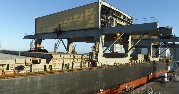 Trucks lining up to export aluminum from Australian port - 4K 30P.