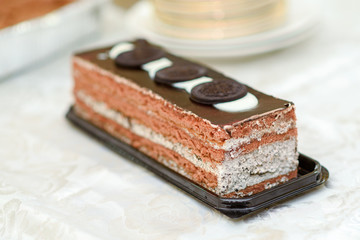 Delicious chocolate mousse cake on the table. Selective focus.