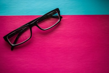 eye glasses on a colored background