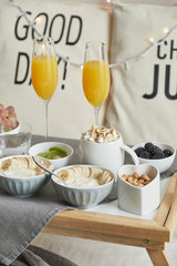 Close-up view of delicious breakfast served in bed on tray