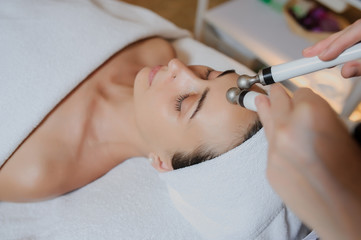 Lateral view of woman facial massage