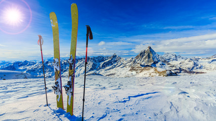 Ski in winter season, mountains and ski touring backcountry equipments on the top of snowy...