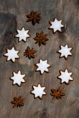 Obraz na płótnie Canvas assortment of christmas cookies stars on grey wooden background