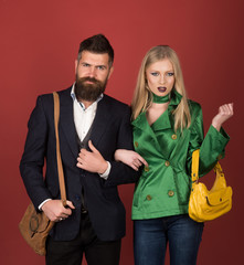 Fashion and beauty. Autumn street style. Love relations. Autumn fashion trends. Couple in love in fashionable style. Fashion couple of sexy woman and bearded man. Enjoying friendly relations