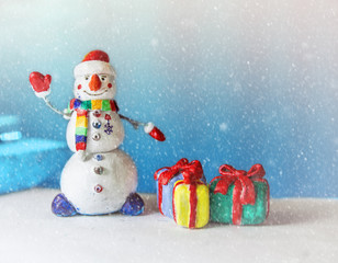 Little snowman figurine with decorations, Christmas greeting card