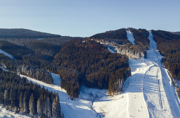 aerial view of a skii resort in the carpathian mountains on a sunny day