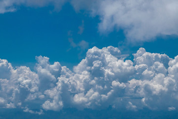 The blue sky with the white clouds in the sunny day or in summer season.