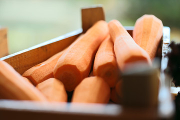 The image of carrots on the counter in the store or on the buffet. The concept of proper nutrition. Cropped shot, close-up, horizontal