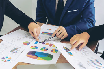 close up hand of marketing manager employee pointing at business document during discussion at meeting room - Business concept