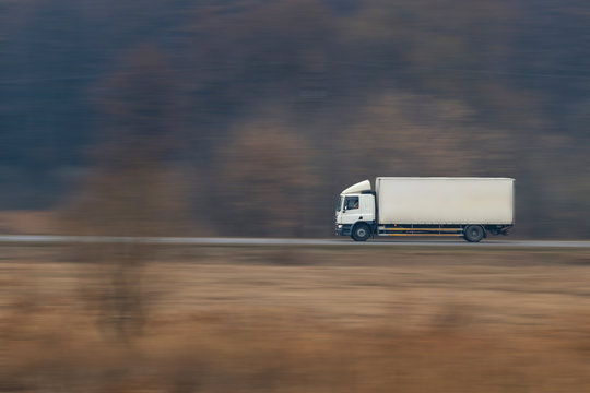 Truck going fast on a suburban road