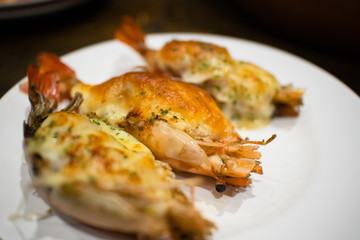 Steamed stuffed shrimps on white dish.