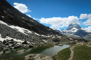 Scenic bright view of Matterhorn and clouds around, Swiss Alps near Zermatt