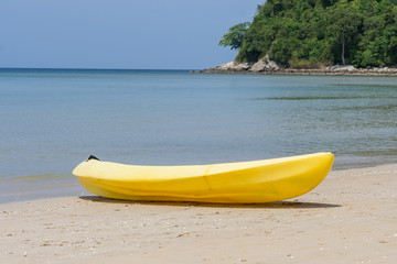 Fototapeta na wymiar Summer concept - Yellow kayaks on the tropical beach, Phuket island, Thailand 