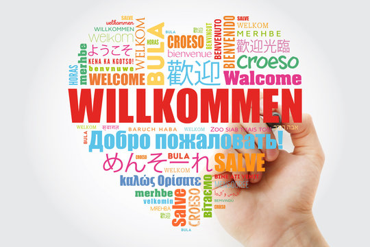 Willkommen (Welcome in German) love heart word cloud in different languages with marker