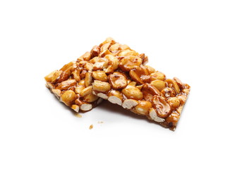 Caramel peanut bar isolated on white background