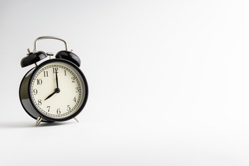 Alarm clock isolated on white background with selective focu