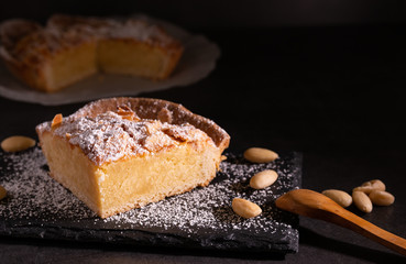 homemade almond frangipane cake in selective lighting