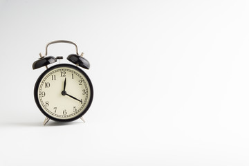 Alarm clock isolated on white background with selective focu