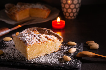 homemade almond frangipane cake in selective lighting