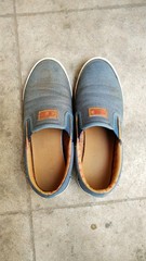 Dirty Blue Color Canvas Shoes Pair Under Natural Light