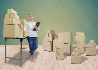 Young business woman, entrepreneur holding a clipboard, check the product