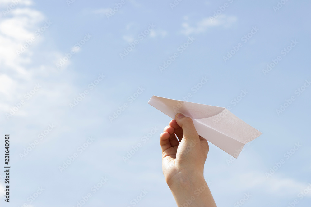 Wall mural paper airplane. sky background.