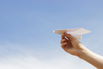 paper airplane. sky background.