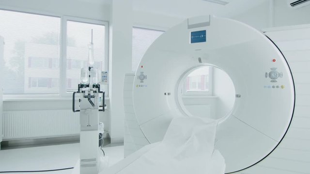 Medical CT or MRI or PET Scan Standing in the Modern Hospital Laboratory. Technologically Advanced and Functional Mediсal Equipment in a Clean White Room. Slowly Zooming Shot.