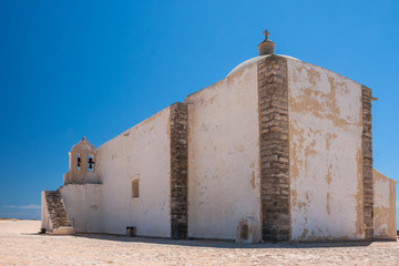 White old stone chapel at Fortaleza de Sagres, Algarve, Portugal