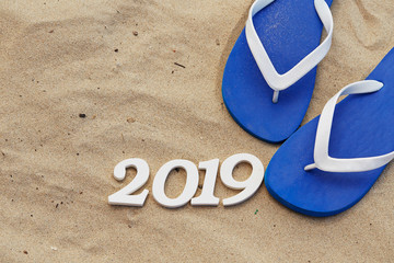 Year 2019 with flip flop background 