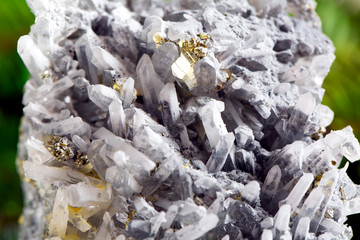 Macro shooting of natural gemstone. The raw mineral is pyrite, China. Isolated object on a white background.