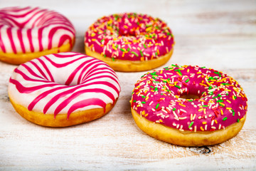 Donuts on a wooden background.