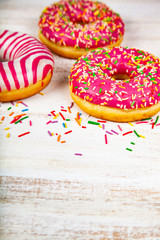 Donuts on a wooden background.