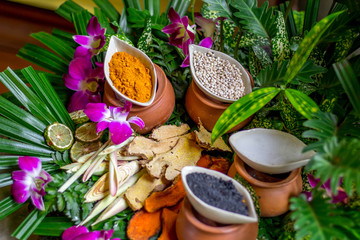 The massage or spa herbal set display in the container such as tumeric powder sesami seed salt 