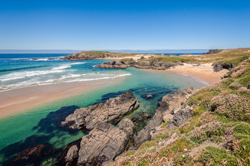 Fototapeta na wymiar Landscape with sea,cliff, beach and blue sky.