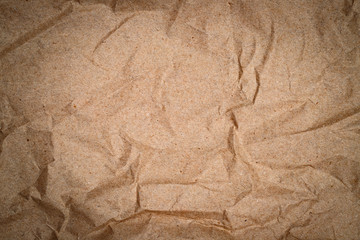 Crumpled brown wrapping  paper texture. Natural recycled paper for packaging