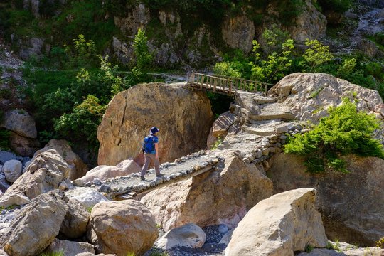 Hiker on bridge, Theth, National Park Theth, Albanian Alps, Prokletije, Qark Shkodra, Albania, Europe