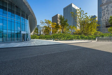 Fototapeta premium cityscape and skyline from empty asphalt road