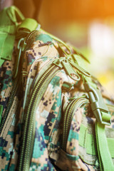 The part of camouflage backpack with zipper and lock 